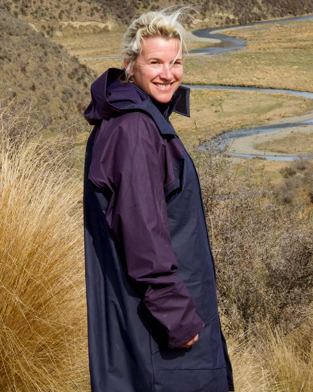 Navy coloured Kaiwaka Agtex Lady of the Land Parka on mountain background 