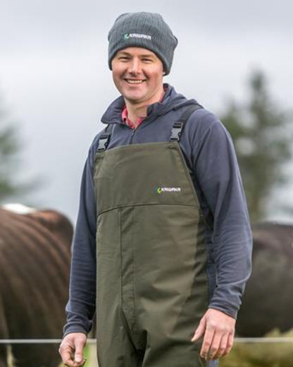 Grey coloured Kaiwaka Cable Knit Beanie on outdoor background 
