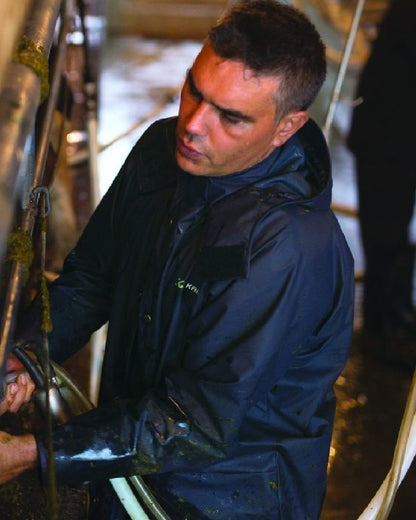 Navy coloured Kaiwaka Mens AgTex Parka on factory background 