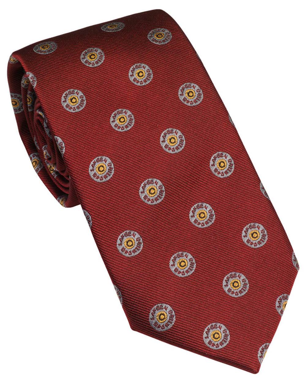 Vintage Red Coloured Laksen Cartridge Cap Tie On A White Background 
