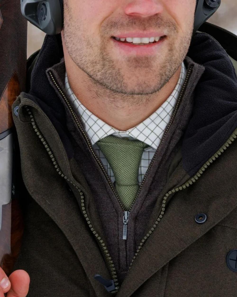 Green coloured Laksen Houndstooth Wool Tie on outdoor background 
