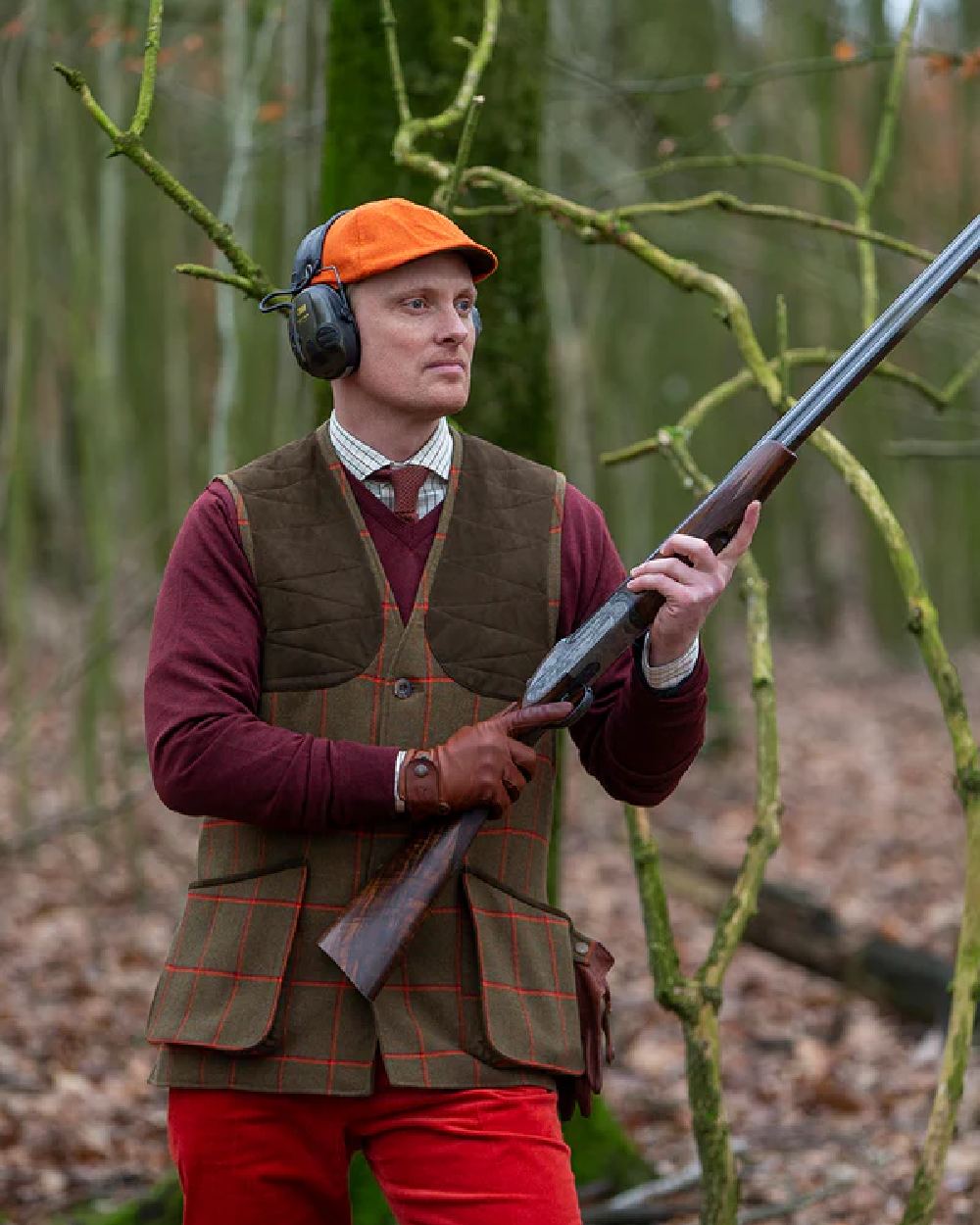Blaze Orange Coloured Laksen Mens Blaze Monty Cap on forest background 