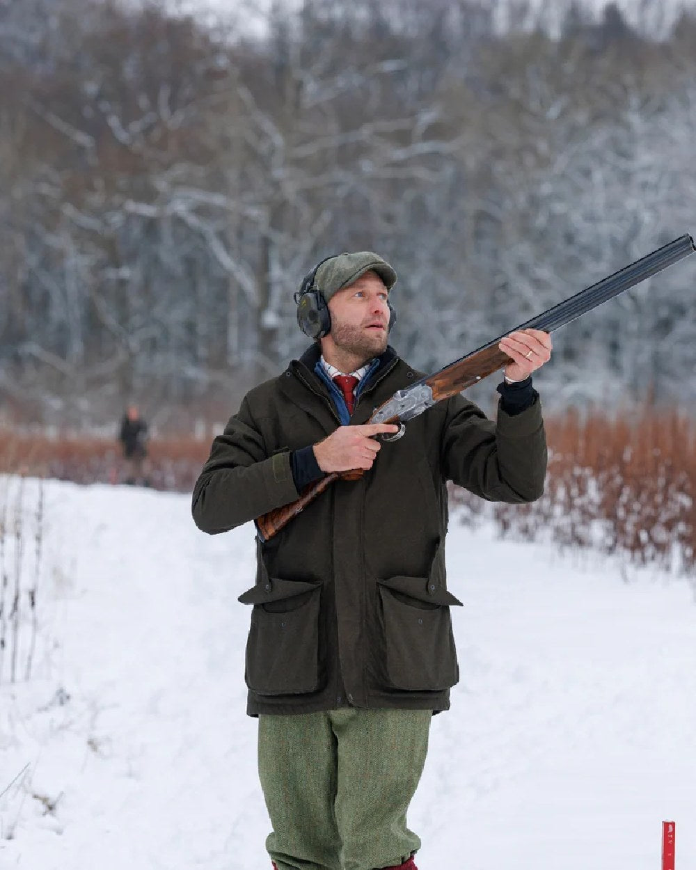 Green Coloured Laksen Mens Falcon Tech Hunting Jacket on Outside Snow Background 