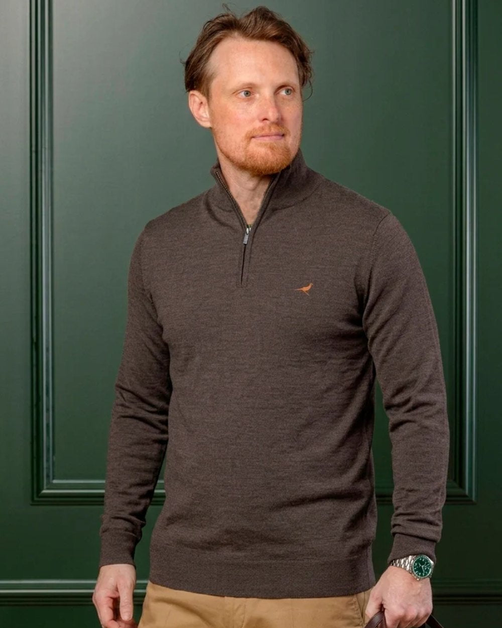 Chocolate Coloured Laksen Norfolk Zip Neck Merino Sweater on indoor background 