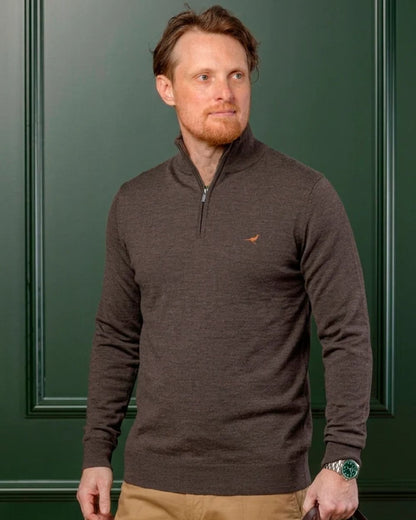 Chocolate Coloured Laksen Norfolk Zip Neck Merino Sweater on indoor background 