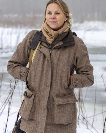 Glyn Tweed Check coloured Laksen Womens Glyn Tweed CTX Waterproof Hunting Jacket on snow background 