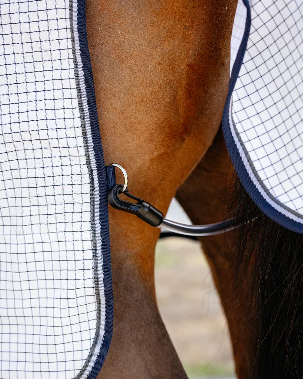 White coloured LeMieux Arika Field Rug on blurry background 