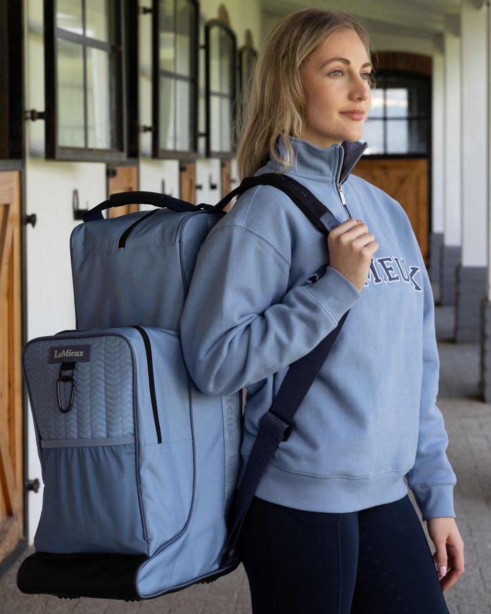 Powder Blue coloured LeMieux Boot &amp; Hat Bag on outdoor background 
