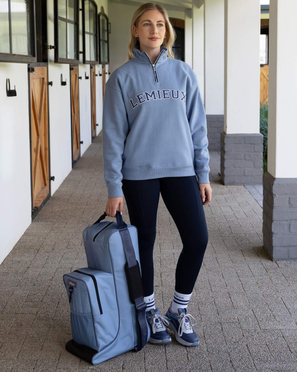 Powder Blue coloured LeMieux Boot &amp; Hat Bag on outdoor background 