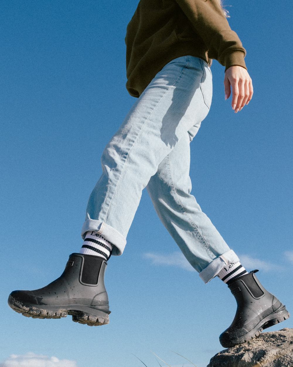 Black coloured LeMieux Bramshaw Chelsea Wellies on rock background 