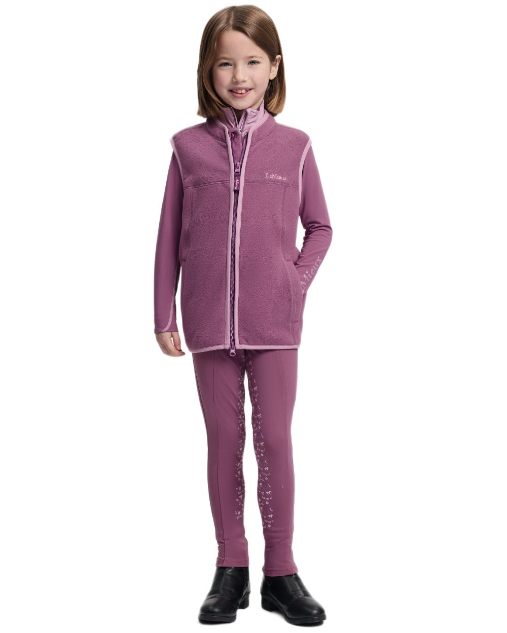 Mallow coloured LeMieux Childrens Bobbi Fleece Gilet on white background 