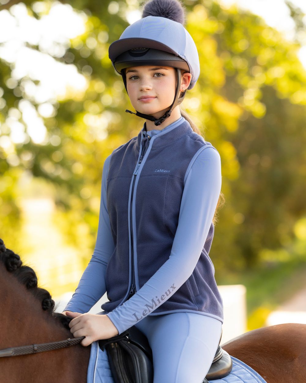 Shadow coloured LeMieux Childrens Bobbi Fleece Gilet on outdoor background 