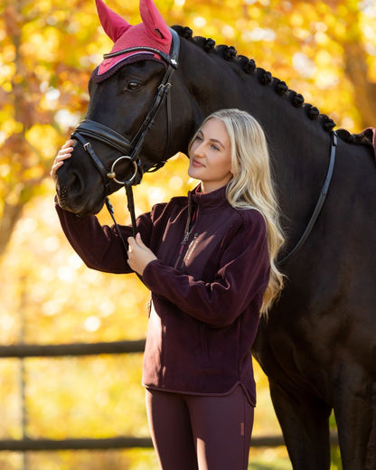 Damson coloured LeMieux Clara Hybrid Fleece on tree background 