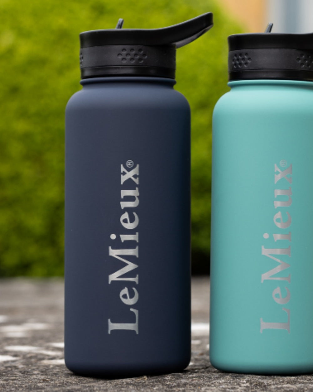 Navy coloured LeMieux Drinking Bottle on outdoor background 