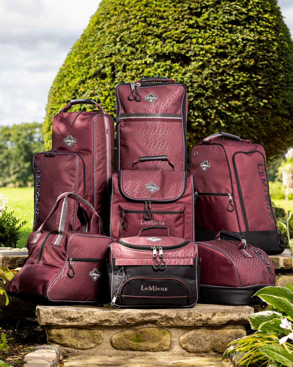 Burgundy coloured LeMieux Elite Pro Bridle Bag on outdoor background 