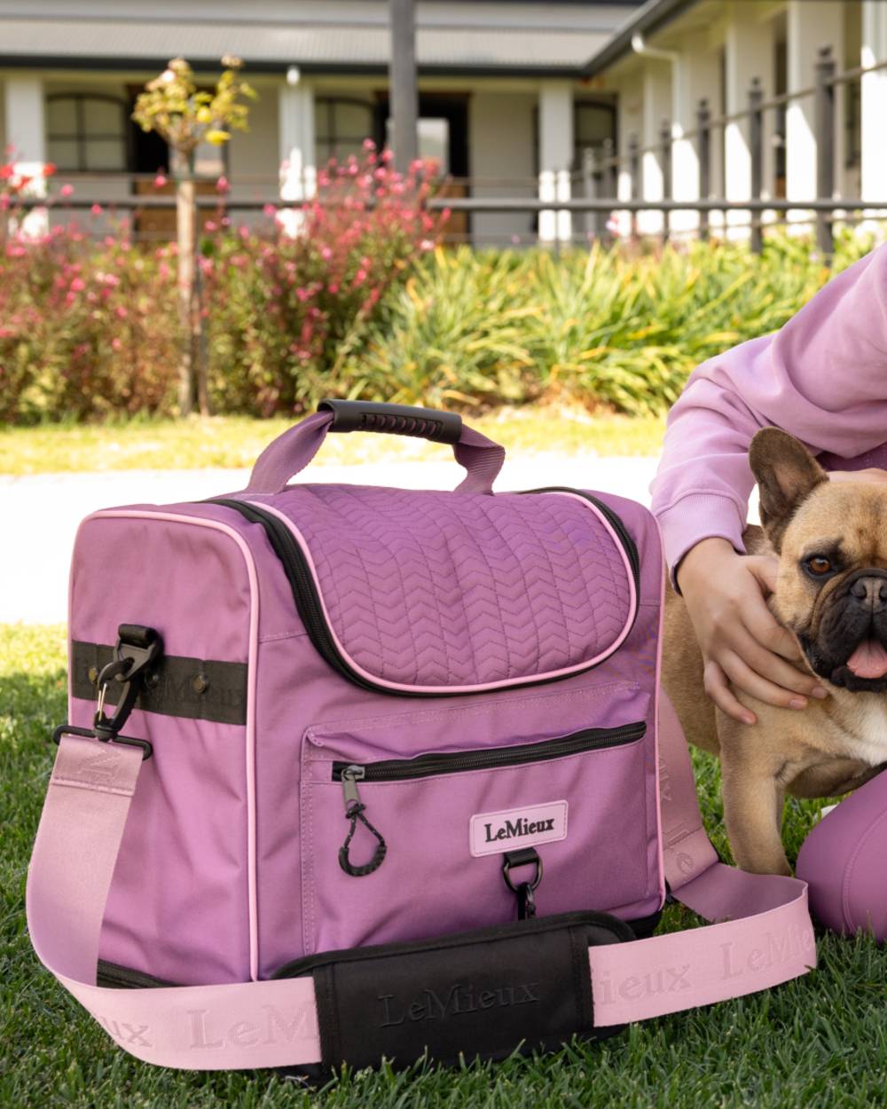 Mallow coloured LeMieux Elite Pro Grooming Bag on garden background 