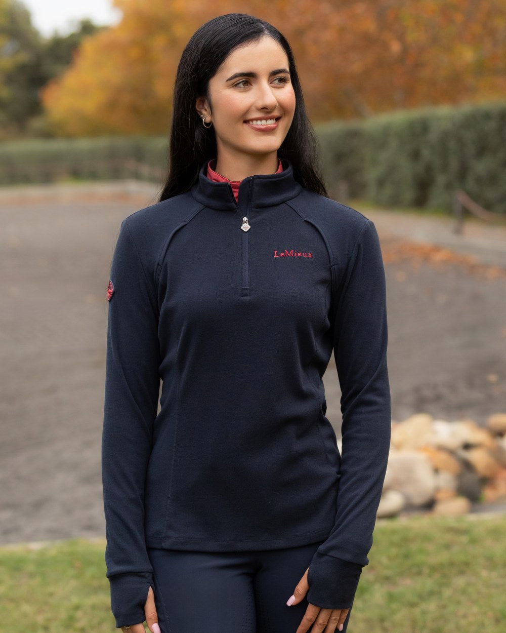Navy coloured LeMieux Frances Quarter Zip Fleece on outdoor background 