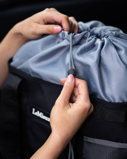 Black coloured LeMieux Grooming Tote on black background 