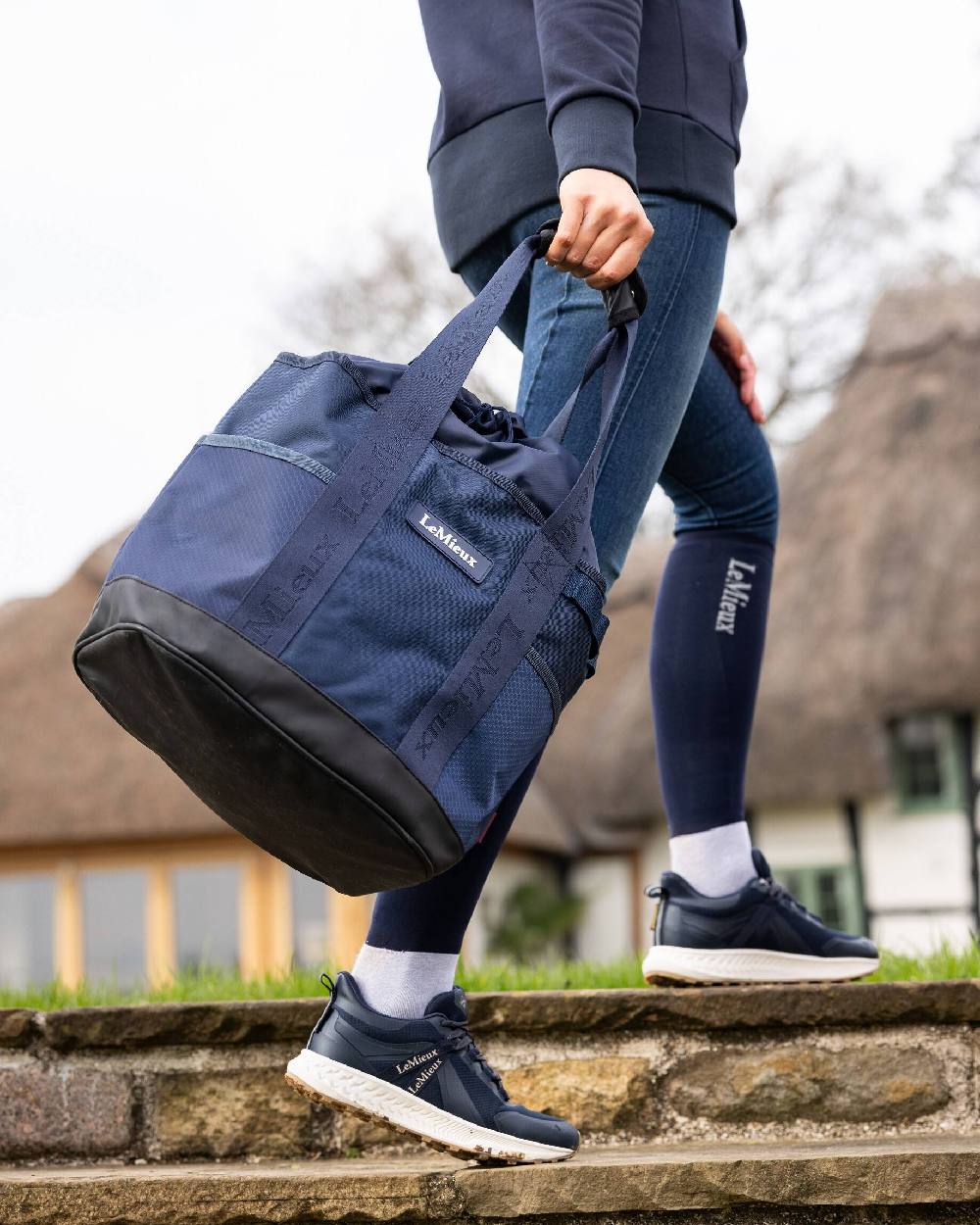 Navy coloured LeMieux Grooming Tote on blurry background 