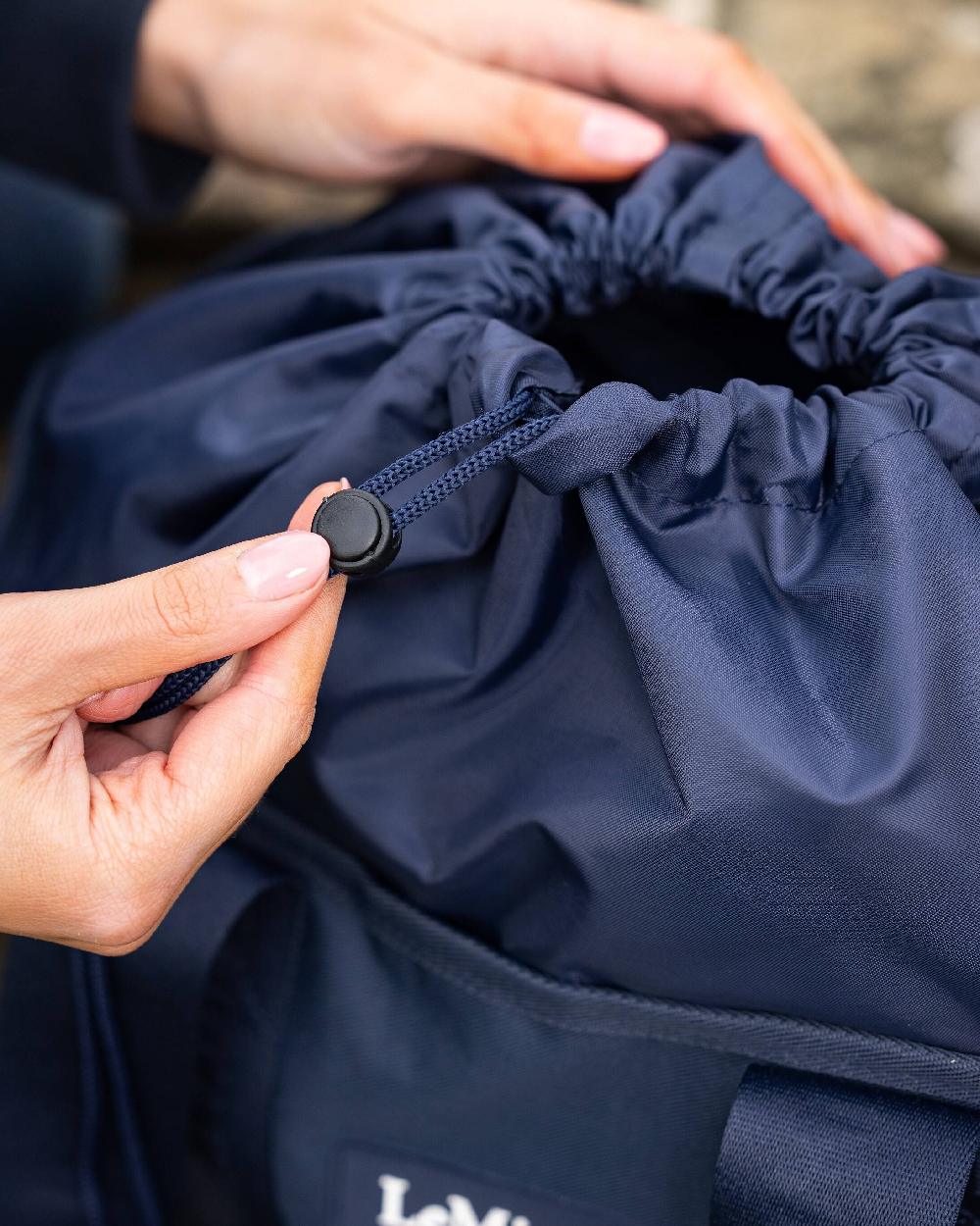 Navy coloured LeMieux Grooming Tote on blurry background 