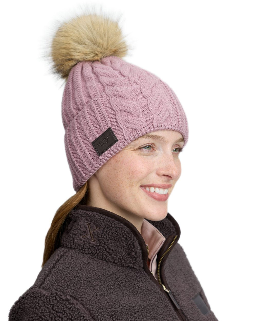 Wild Rose coloured LeMieux Heritage Beanie on white background 