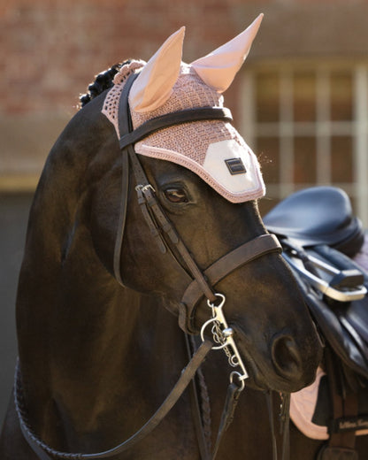 Wild Rose coloured LeMieux Heritage Fly Hood on outdoor background 