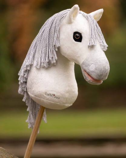 Coco coloured LeMieux Hobby Horse Coco on garden background 