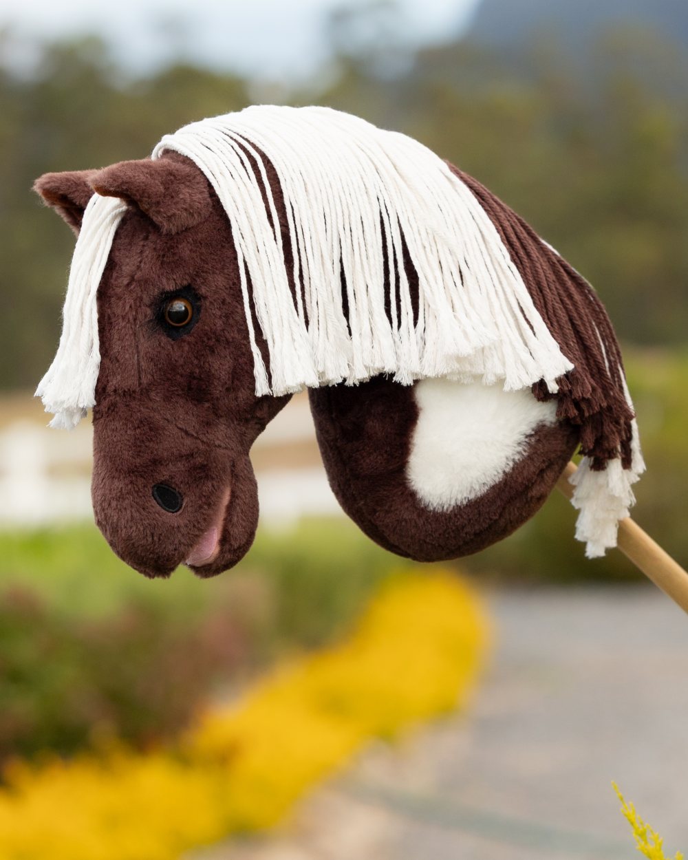 Dazzle coloured LeMieux Hobby Horse Dazzle on outdoor background 