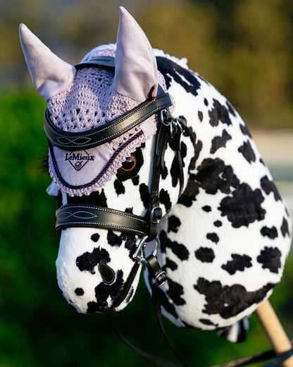 Lilac coloured LeMieux Hobby Horse Fly Hood on outdoor background 