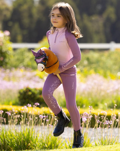 Sundance coloured LeMieux Hobby Horse Lite Sundance on garden background 