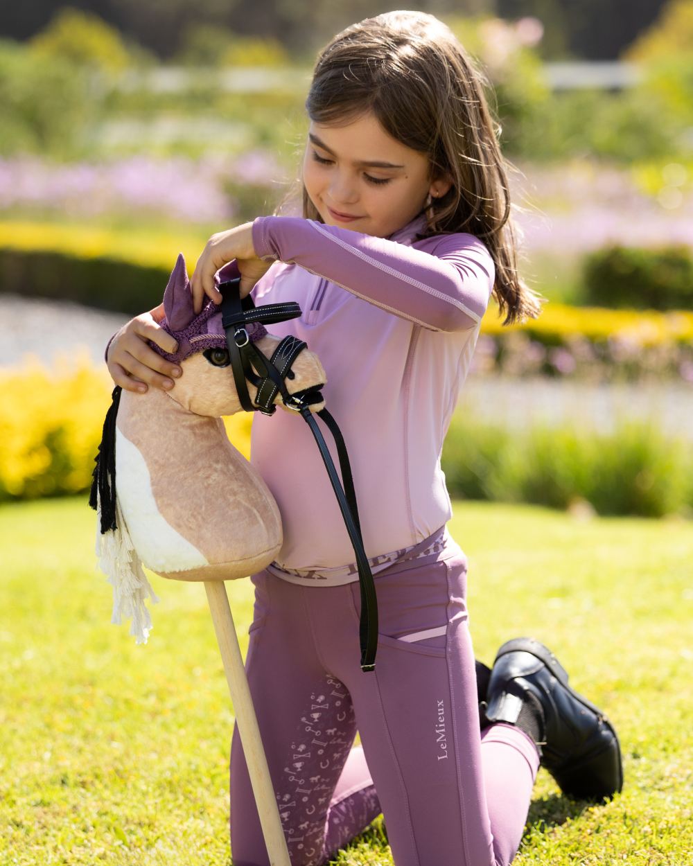 Toby coloured LeMieux Hobby Horse Lite Toby on garden background 