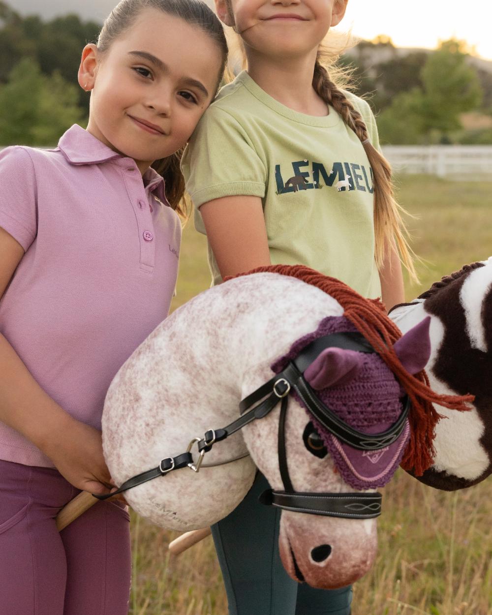 Poppy coloured LeMieux Hobby Horse Poppy on outdoor background 