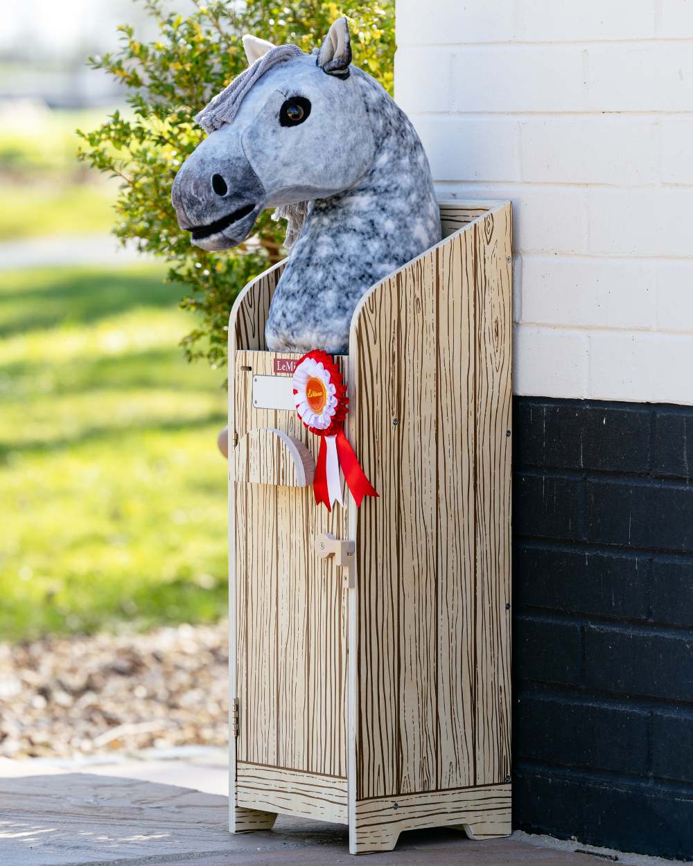 Wooden coloured LeMieux Hobby Horse Stable Wooden on outdoor background 