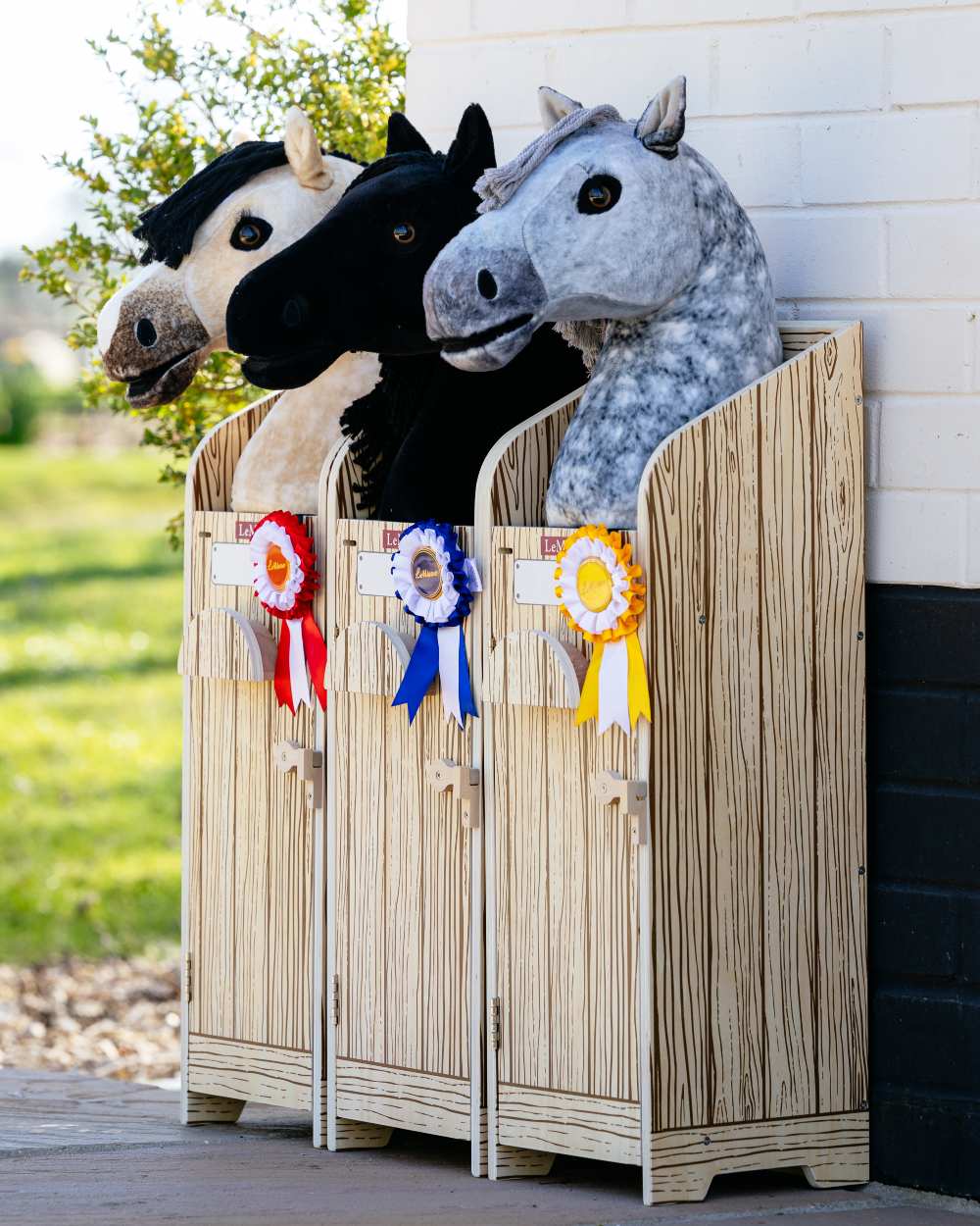 Wooden coloured LeMieux Hobby Horse Stable Wooden on outdoor background 