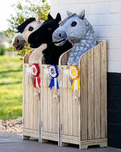 Wooden coloured LeMieux Hobby Horse Stable Wooden on outdoor background 