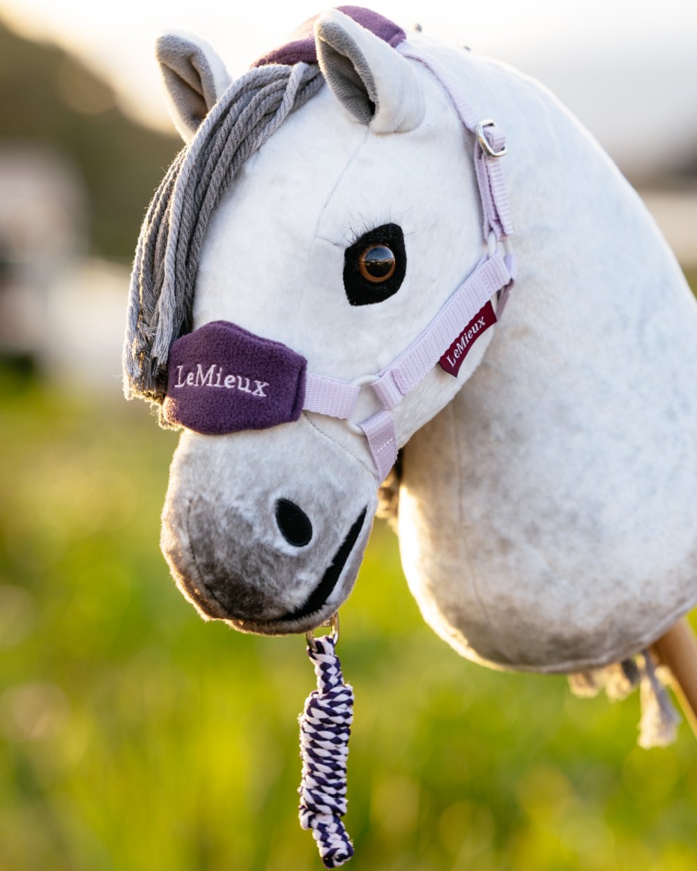 Lilac coloured LeMieux Hobby Horse Vogue Headcollar on outdoor background 