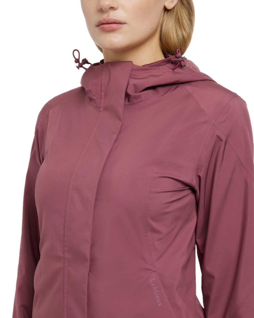 Rosewood coloured LeMieux Isla Short Waterproof Jacket on brown background 