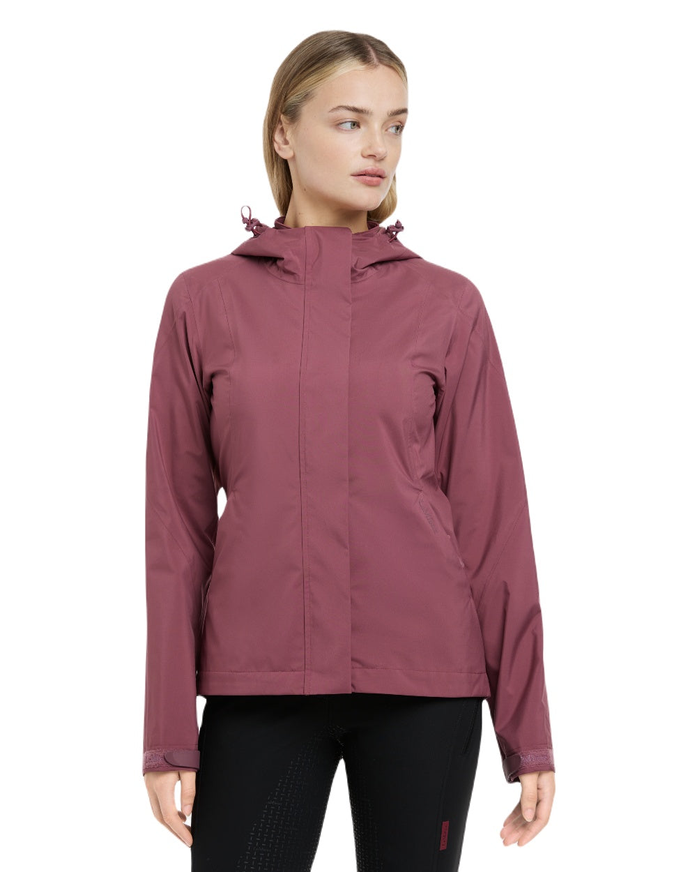 Rosewood coloured LeMieux Isla Short Waterproof Jacket on brown background 