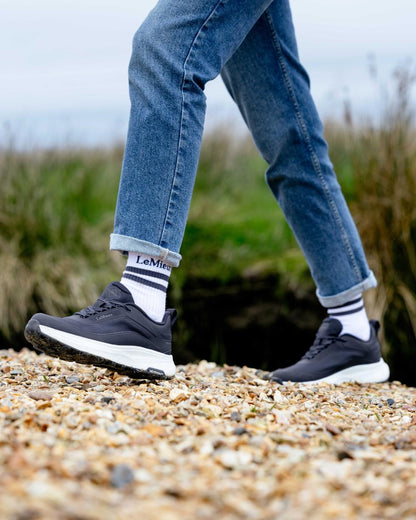 Navy coloured LeMieux Womens Kanta Waterproof Trainers on beach background 