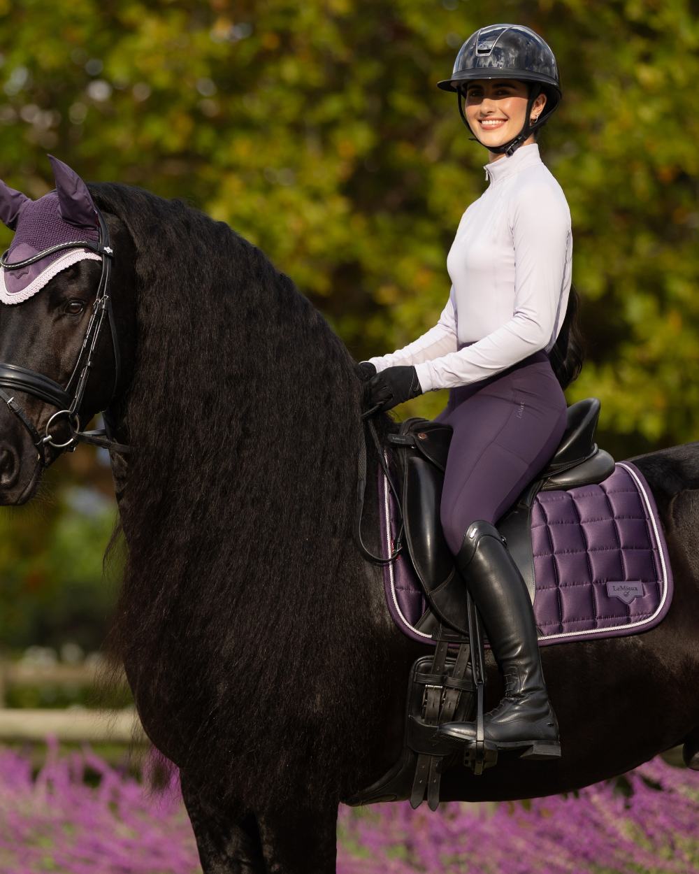 Juniper coloured LeMieux Loire Dressage Square on tree background 