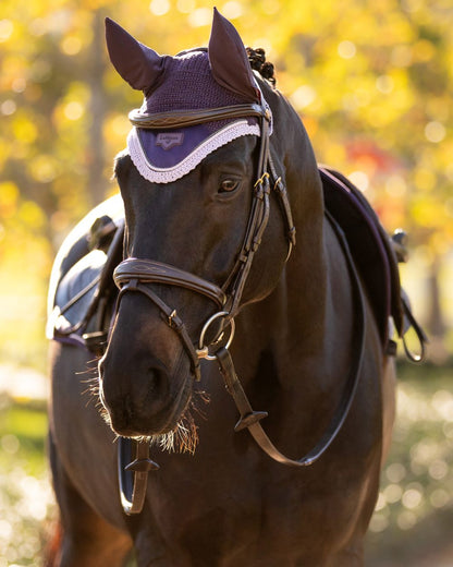 Juniper coloured LeMieux Loire Fly Hood on blurry background 
