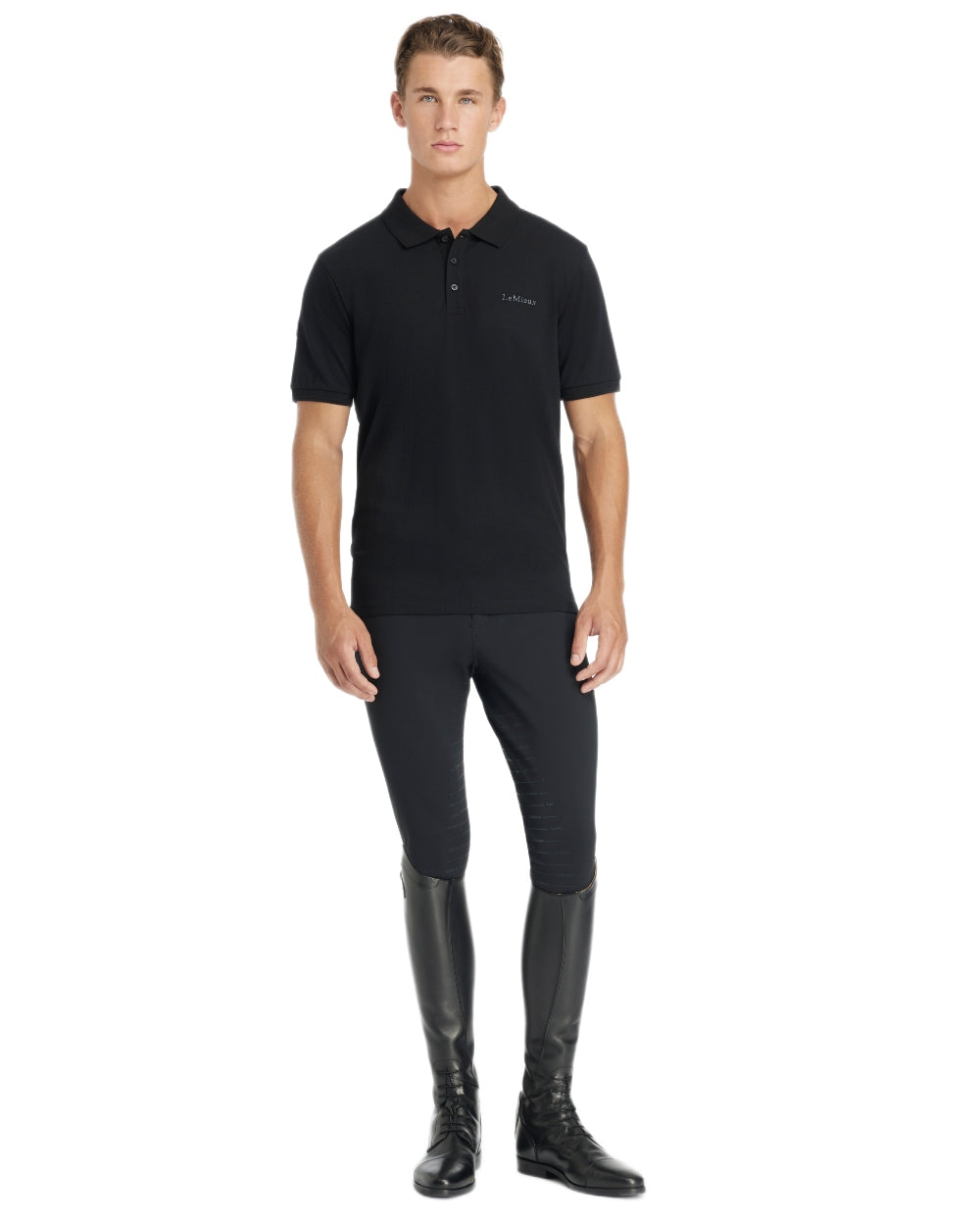 Black coloured LeMieux Mens Classique Polo T-Shirt on white background 