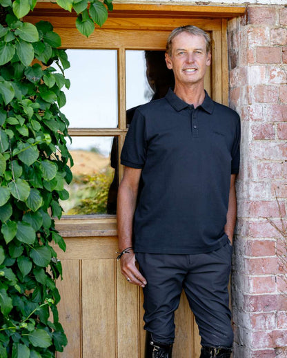 Navy coloured LeMieux Mens Classique Polo T-Shirt on outdoor background 