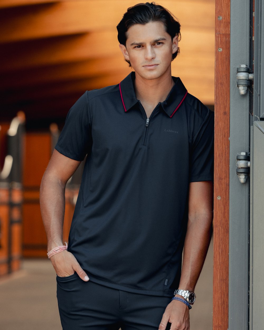Navy coloured LeMieux Mens Performance Polo T-Shirt on outdoor background 
