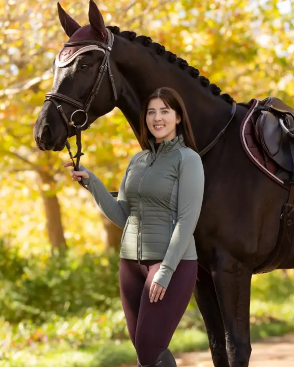 Damson coloured LeMieux Naomi Pull On Breeches on outdoor background 