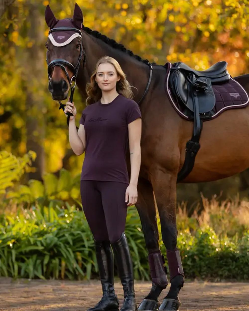 Damson coloured LeMieux Naomi Pull On Breeches on outdoor background 