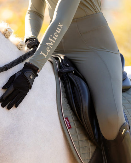 Rosemary coloured LeMieux Naomi Pull On Breeches on outdoor background 