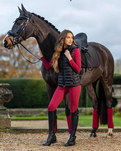 Ember coloured LeMieux Naomi Pull On Breeches on yard background 