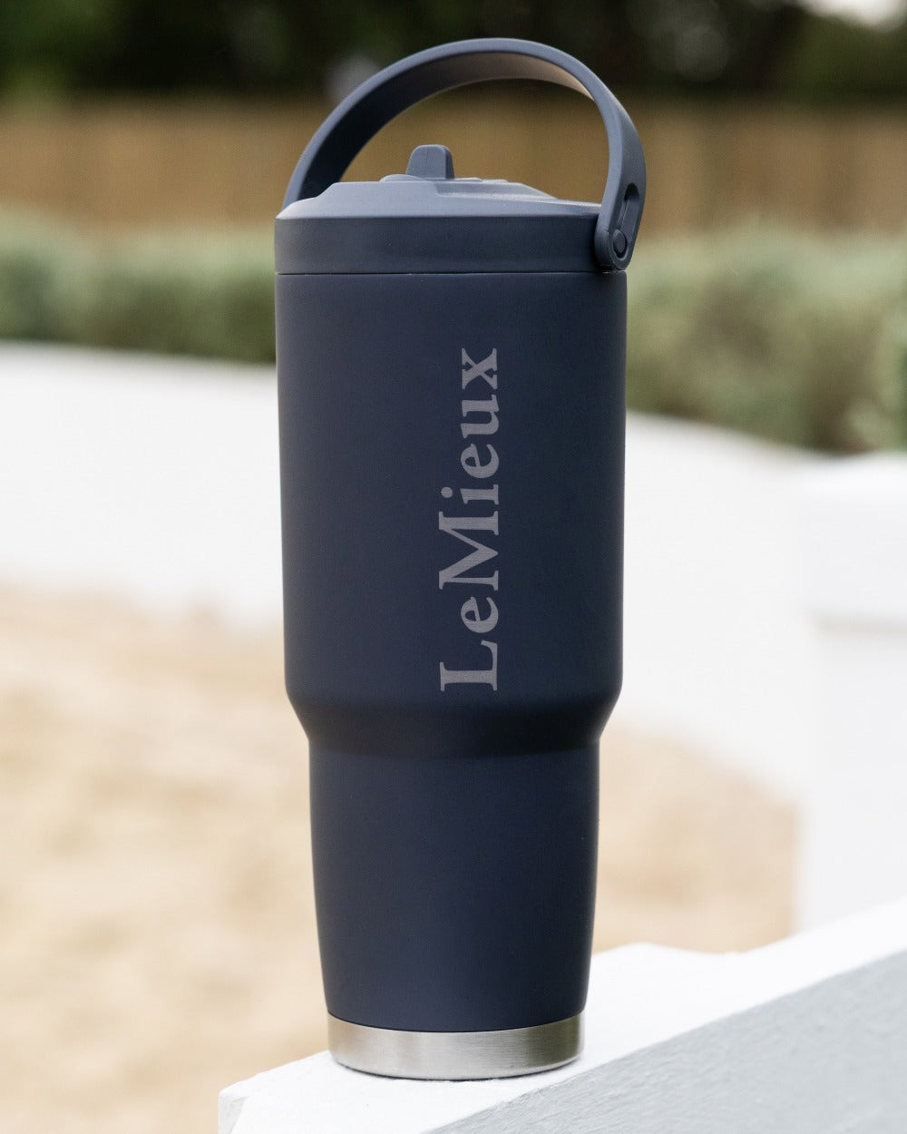 Navy coloured LeMieux Sports Flip Cup on outdoor background 
