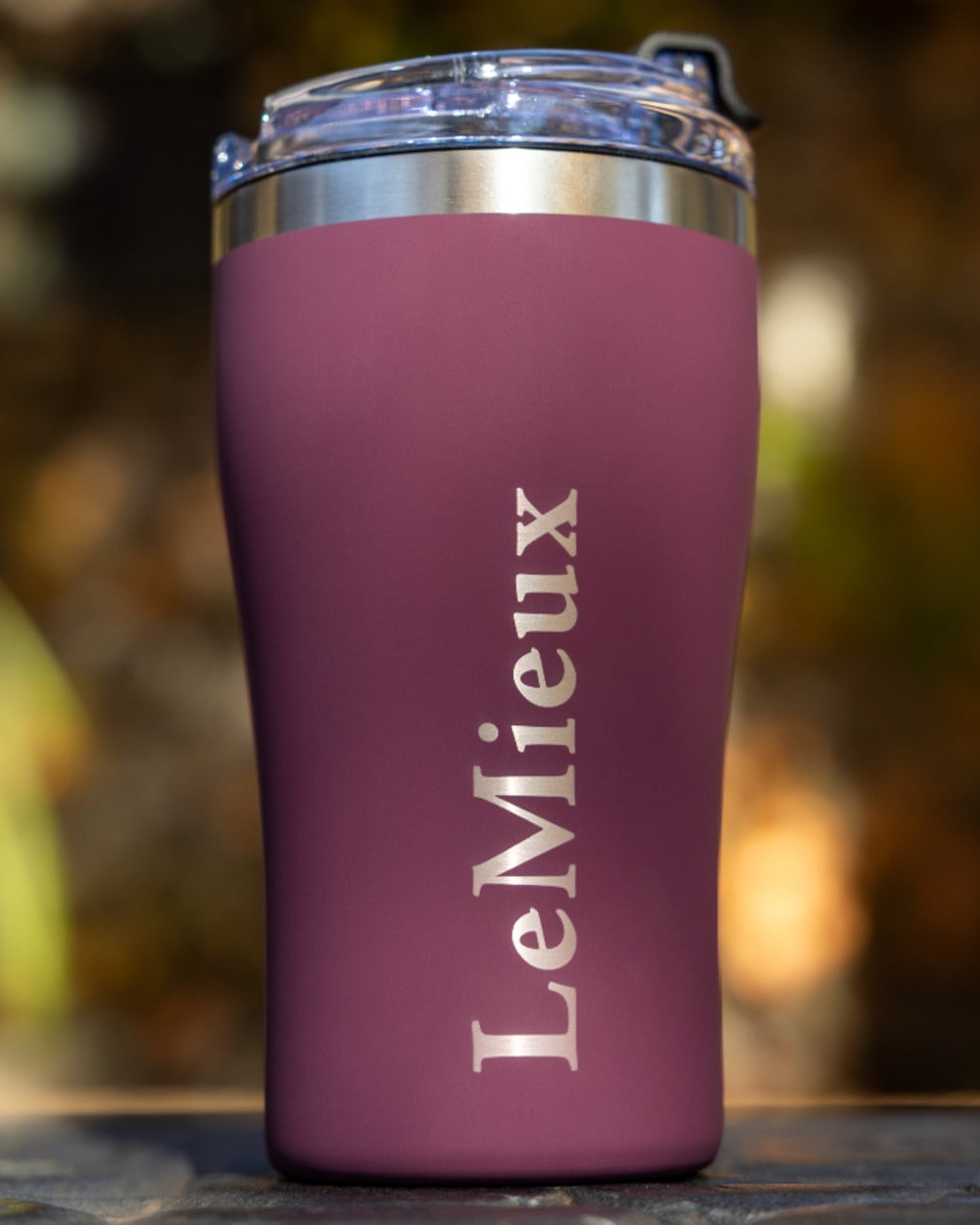 Blackberry coloured LeMieux Stainless Steel Insulated Travel Cup on outdoor background 